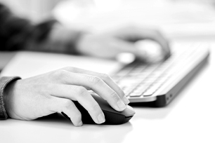 Someone using a mouse on a computer.