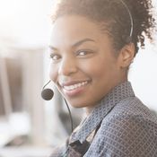 Smiling support representative with headset on