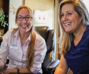 IDEXX representative speaking with female veterinarian during a live Cornerstone training.