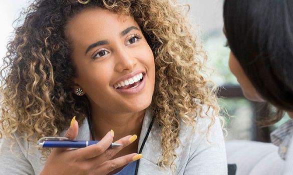 Local Veterinary Diagnostic Consultant sitting with veterinarian to discuss how she can grow her practice by implementing preventive care protocols.