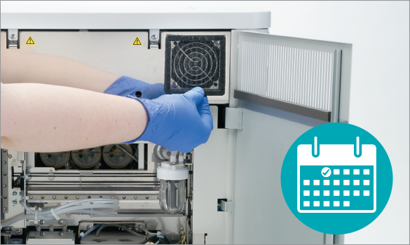 Technician cleaning the ProCyte Dx fan filter once a month