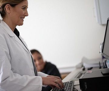 Veterinarian using a computer