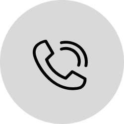 Grey icon of a telephone.