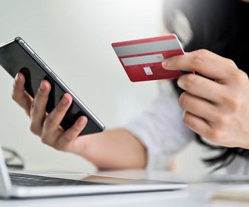 Using a credit card to pay for something online using a phone